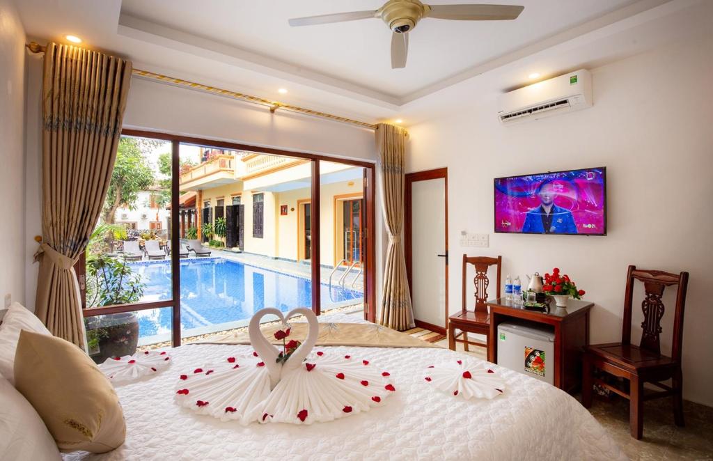 a bedroom with a bed with a heart decoration on it at Lys Homestay in Ninh Binh