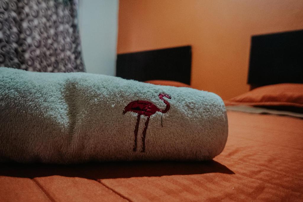 Una cama o camas en una habitación de Bungalows Flamingos