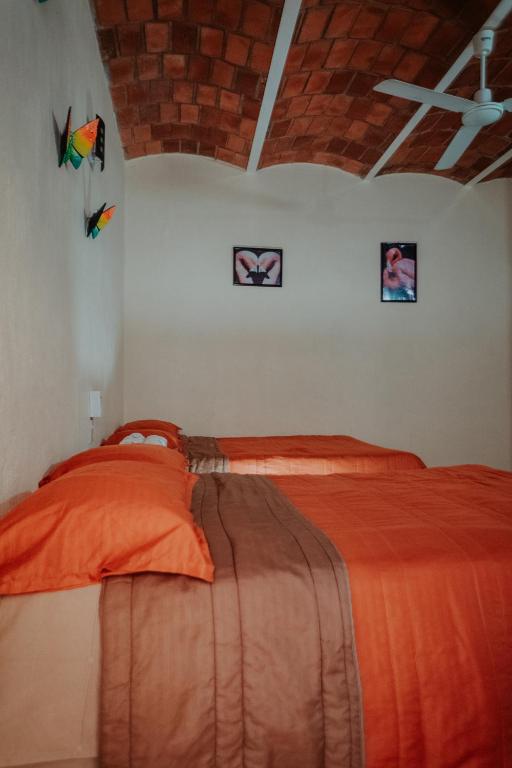 Una cama o camas en una habitación de Bungalows Flamingos