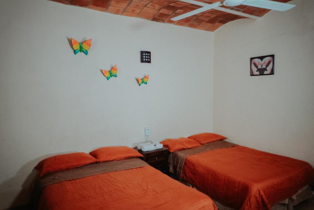 Una cama o camas en una habitación de Bungalows Flamingos