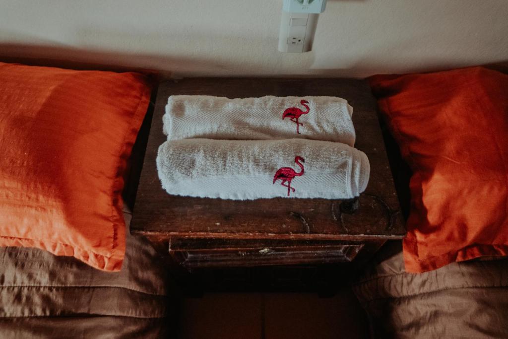 Una cama o camas en una habitación de Bungalows Flamingos