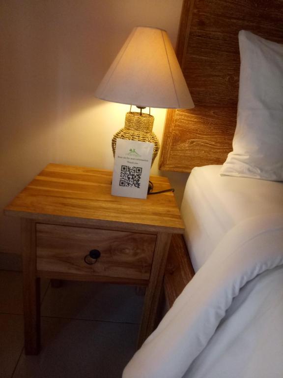 Postel nebo postele na pokoji v ubytování Umah Dajane Guest House