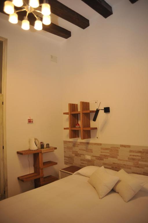 A bed or beds in a room at 3C B&B