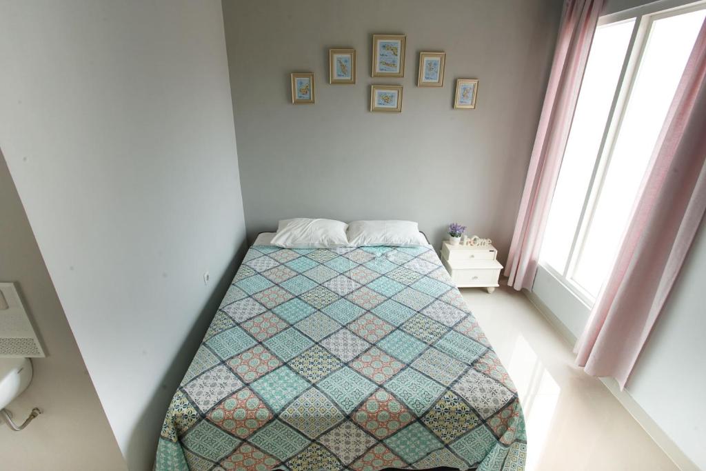 Postel nebo postele na pokoji v ubytování INNI Homestay
