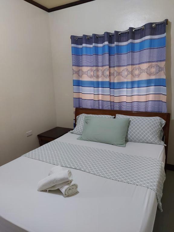 Voodi või voodid majutusasutuse Gardenview Homestay Siargao toas