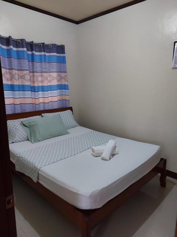 Voodi või voodid majutusasutuse Gardenview Homestay Siargao toas