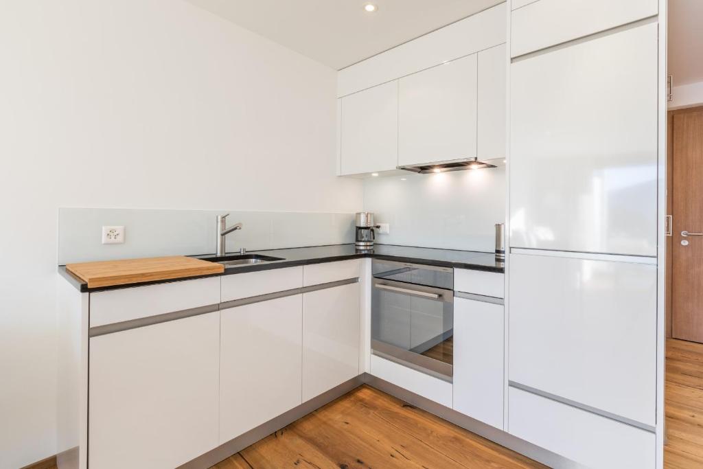 Kuchyň nebo kuchyňský kout v ubytování LAAX Homes - Taviarna Laax 4,5