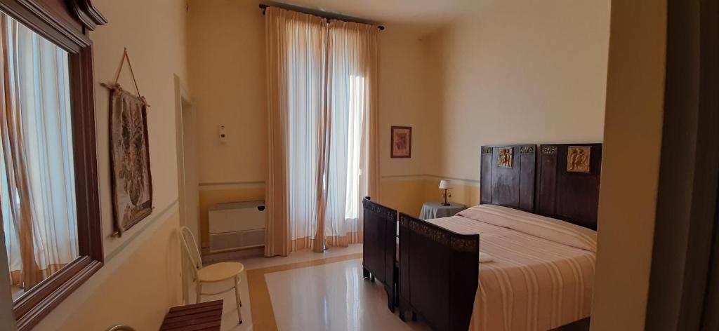 A bed or beds in a room at Hotel Casa Mia