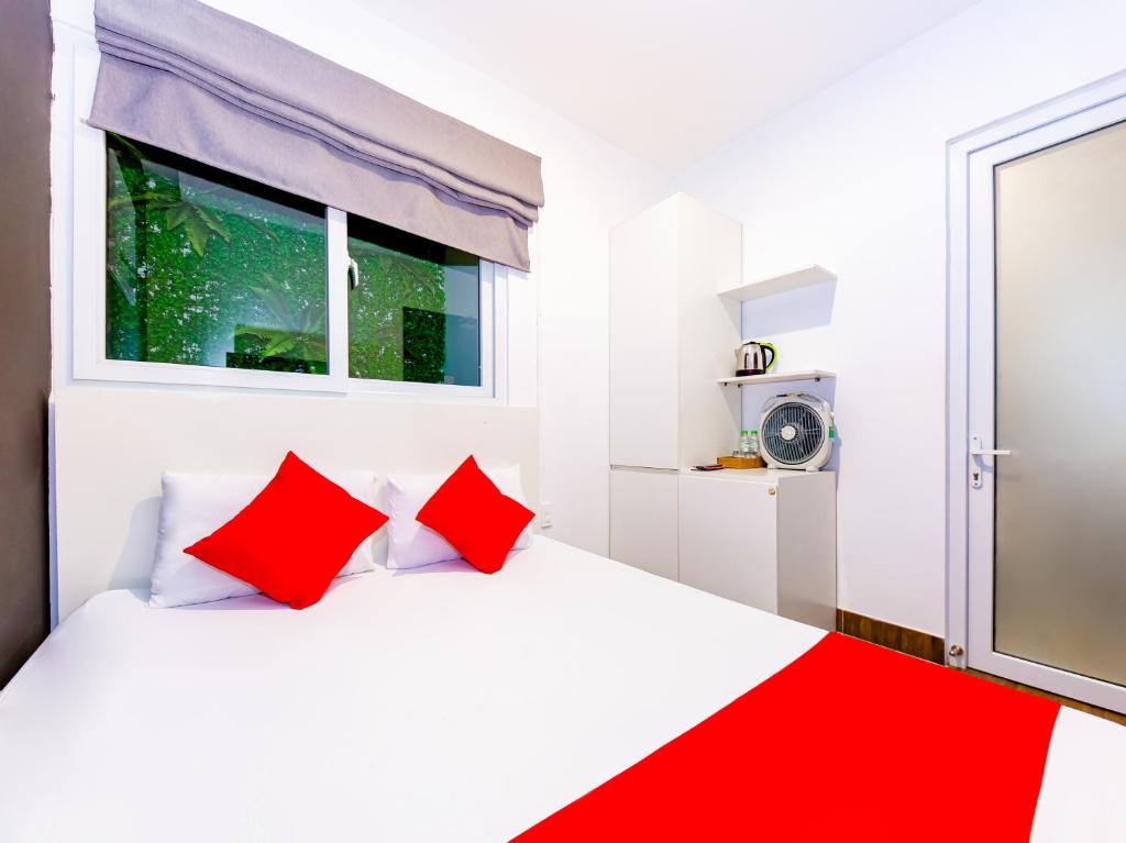 Postel nebo postele na pokoji v ubytování QA Hotel Dalat - City Centre