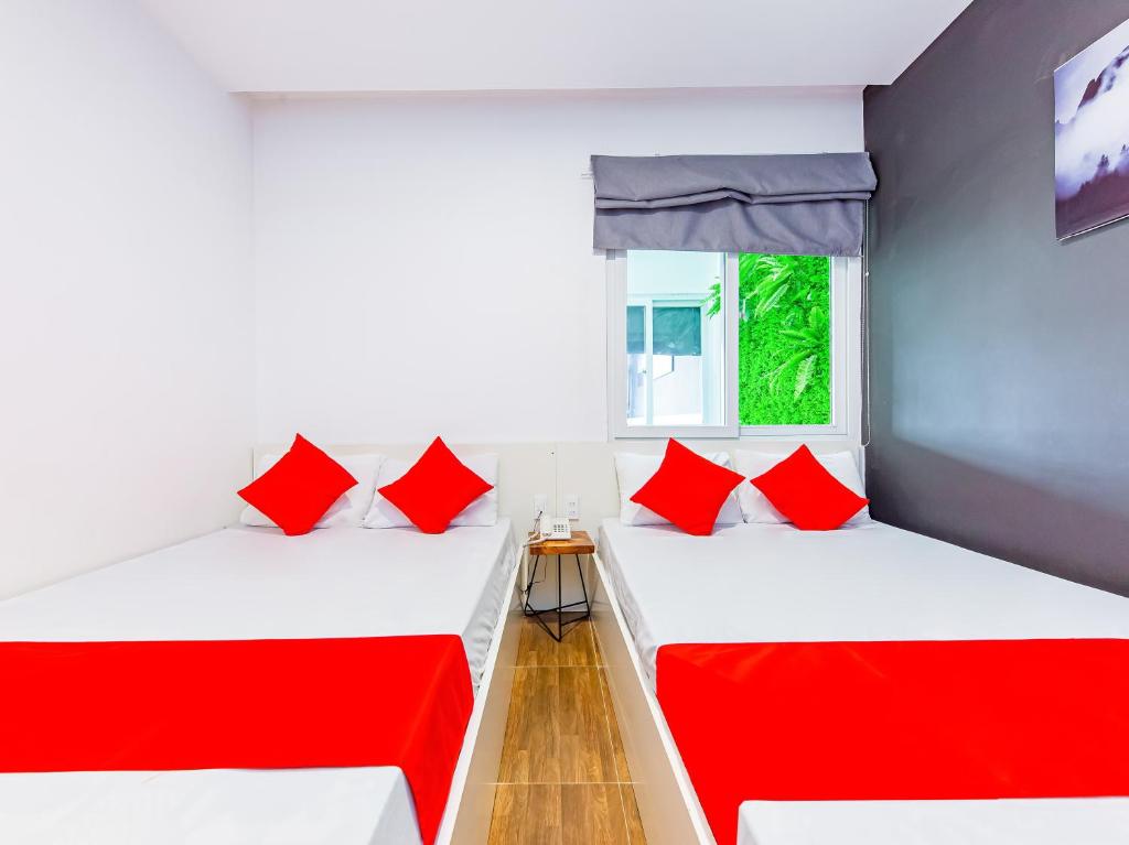 Postel nebo postele na pokoji v ubytování QA Hotel Dalat - City Centre