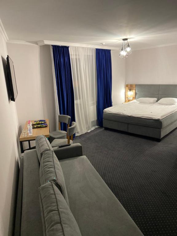 Postel nebo postele na pokoji v ubytování Grofa Apartments