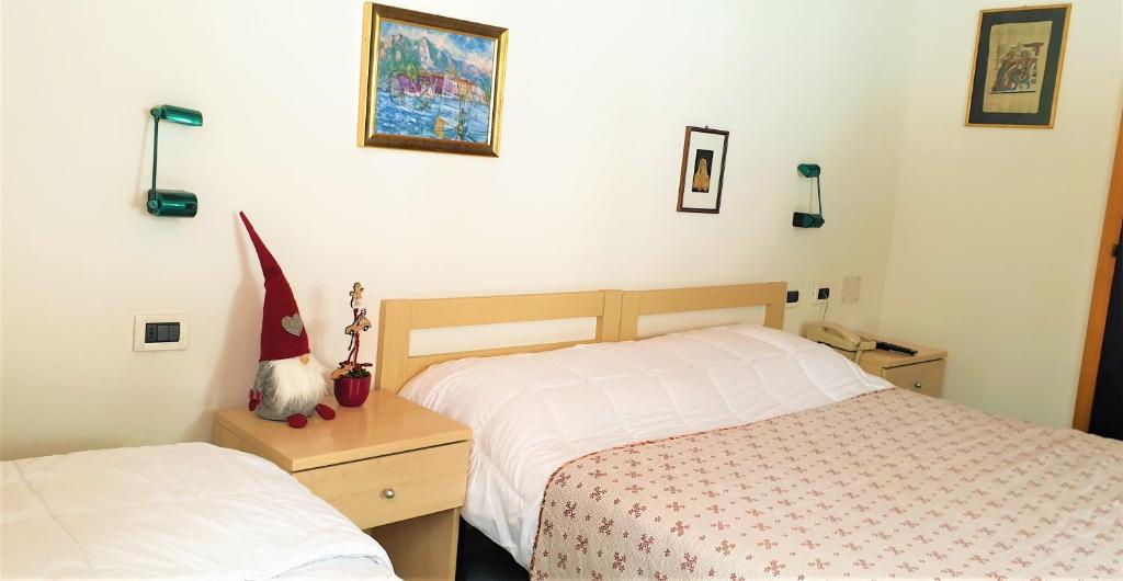 Postel nebo postele na pokoji v ubytování Hotel Martinella