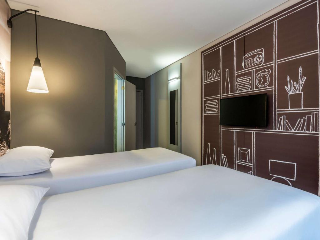 Postel nebo postele na pokoji v ubytování ibis Chia