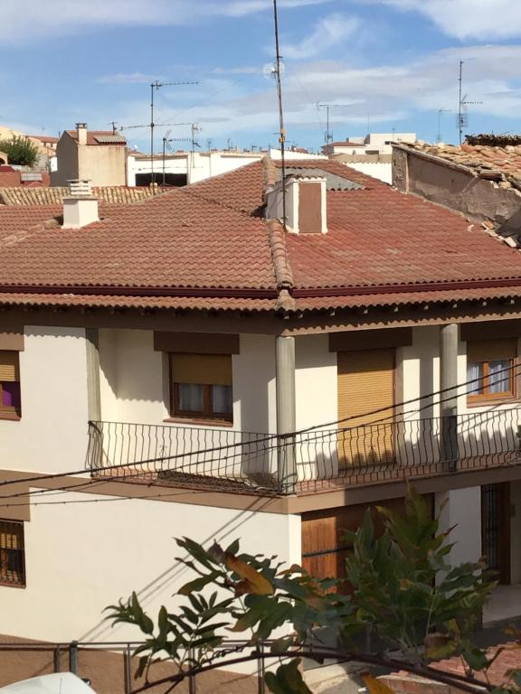 a white house with a red roof at Casa Calanda in Calanda