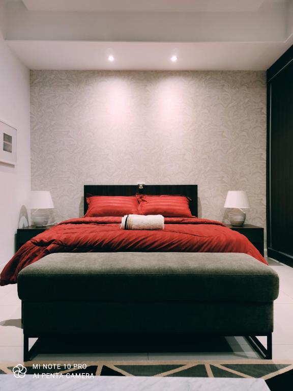 Postel nebo postele na pokoji v ubytování Kumkum Homestay Studio