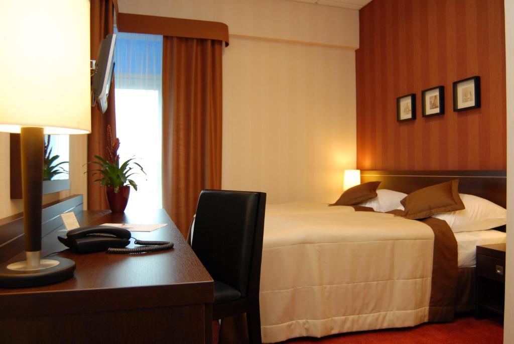 Postel nebo postele na pokoji v ubytování Hotel Pik