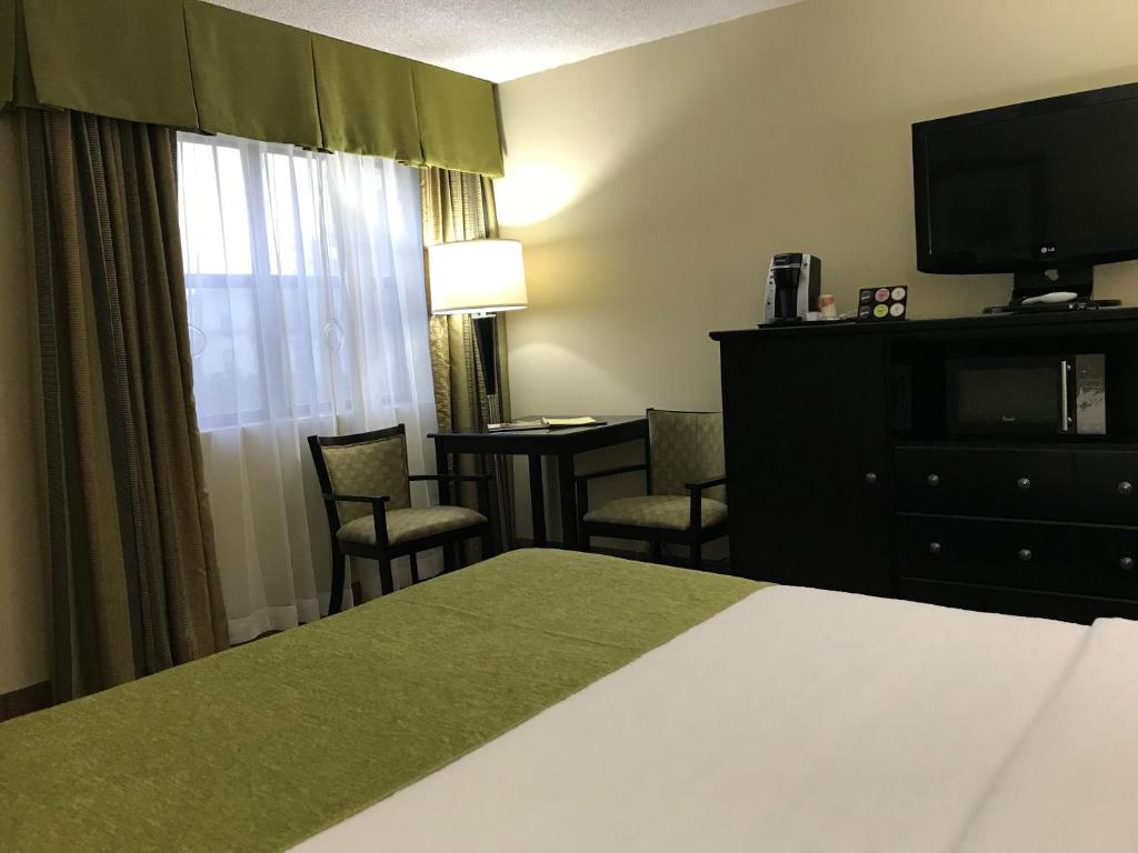 Postel nebo postele na pokoji v ubytování NavajoLand Hotel