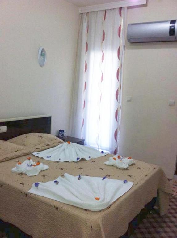 Postel nebo postele na pokoji v ubytování Anatolia Hotel