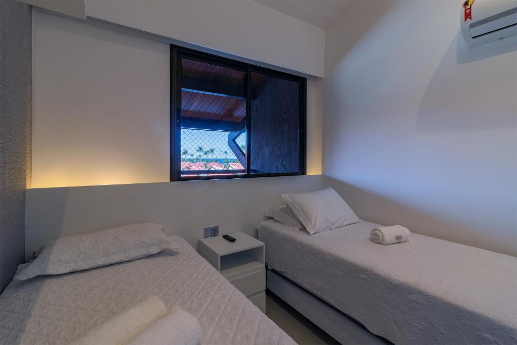  OKA Beach Resort Muro Alto Luxo por Carpediem