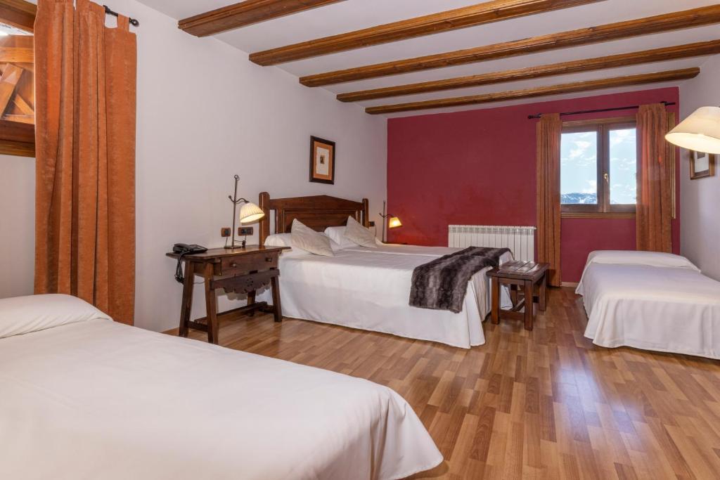 Postel nebo postele na pokoji v ubytování Hotel Casa Cornel