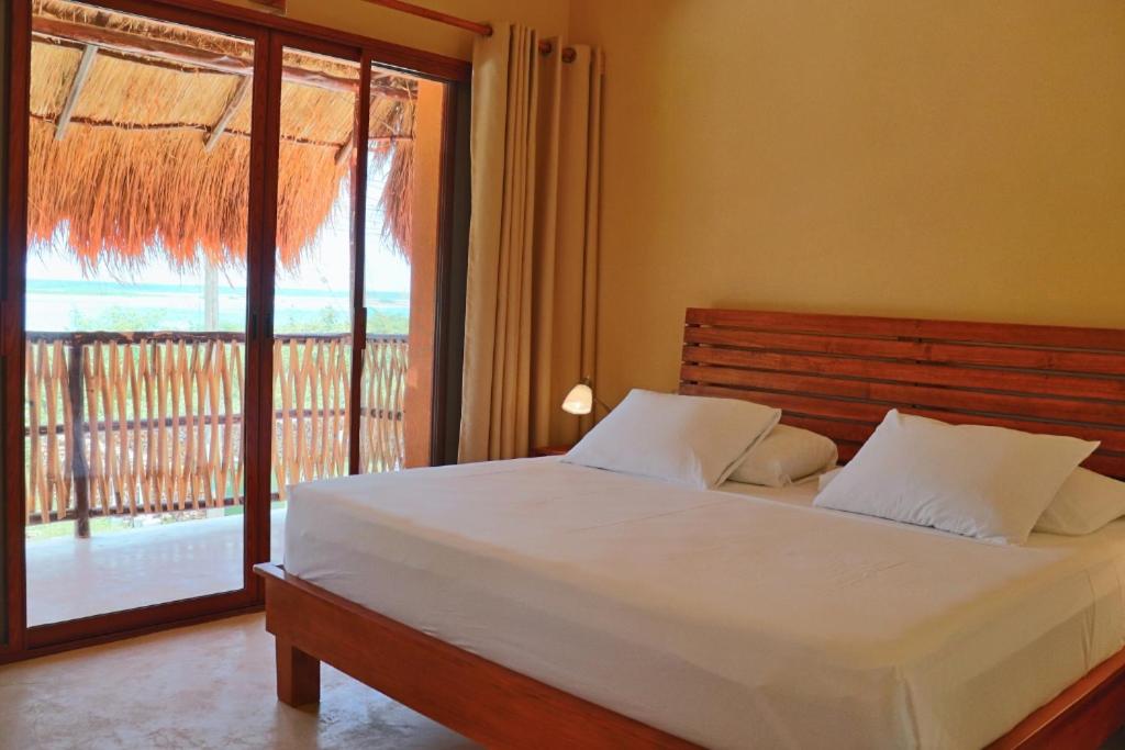 Postel nebo postele na pokoji v ubytování Hotel Sur Bacalar