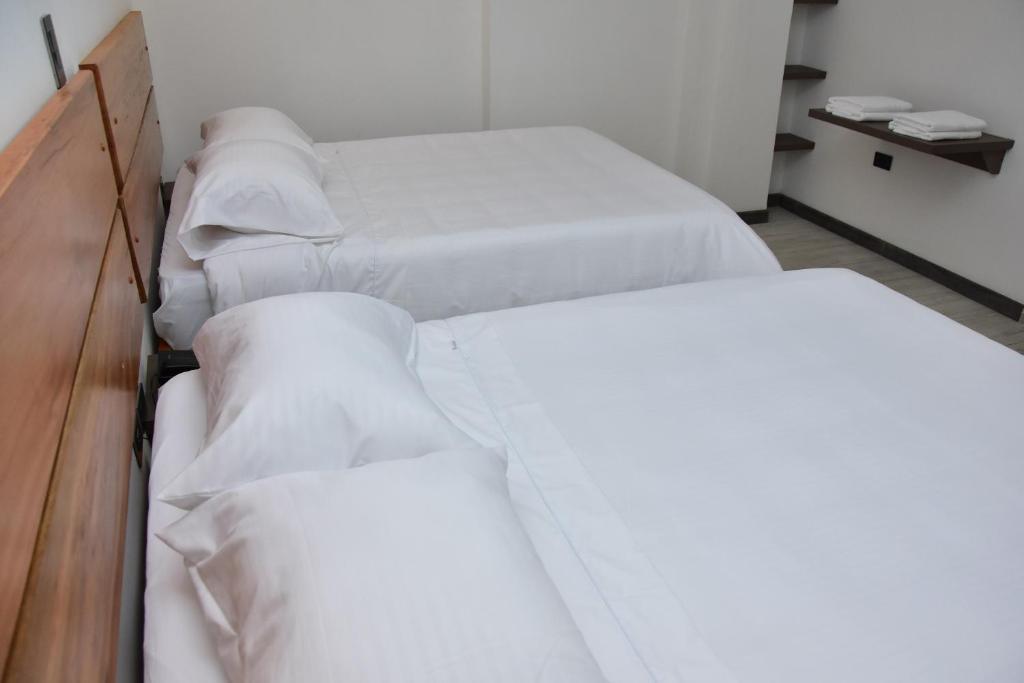 Postel nebo postele na pokoji v ubytování Hotel Válcon