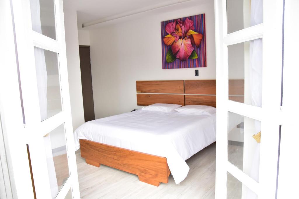 Postel nebo postele na pokoji v ubytování Hotel Válcon
