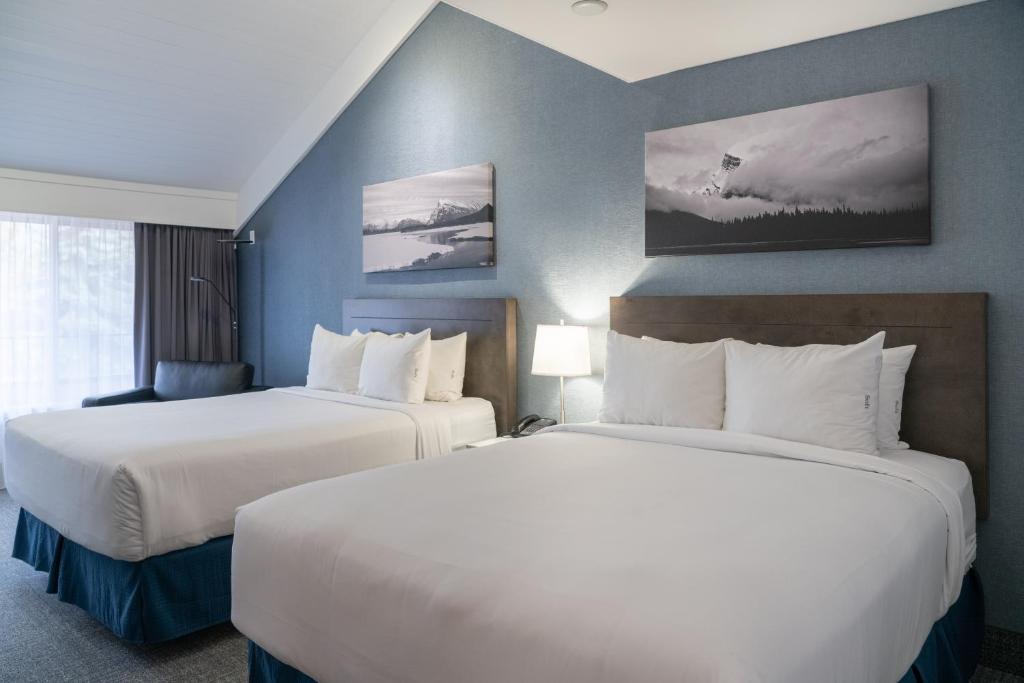 Postel nebo postele na pokoji v ubytování Red Carpet Inn