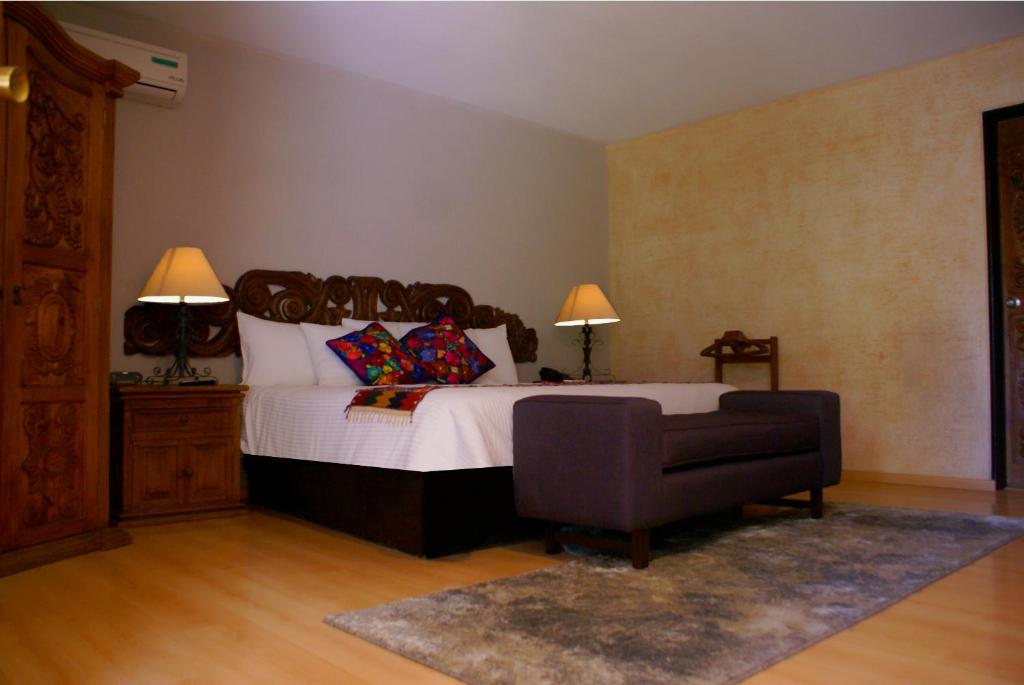 Postel nebo postele na pokoji v ubytování Hotel Real de Minas Tradicional