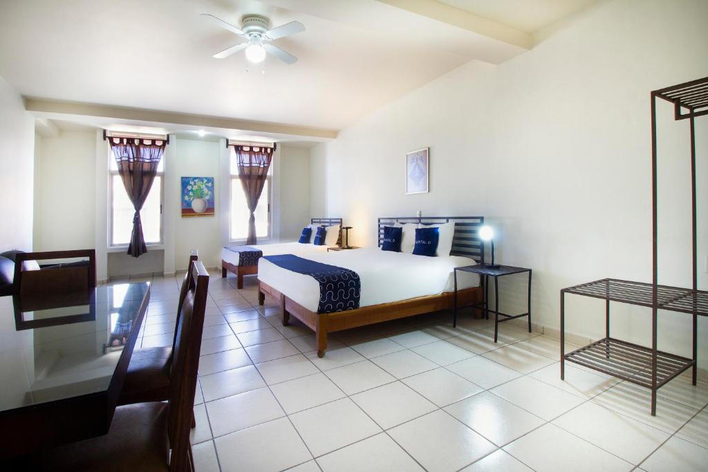 Postel nebo postele na pokoji v ubytování Hotel Plaza Galindo