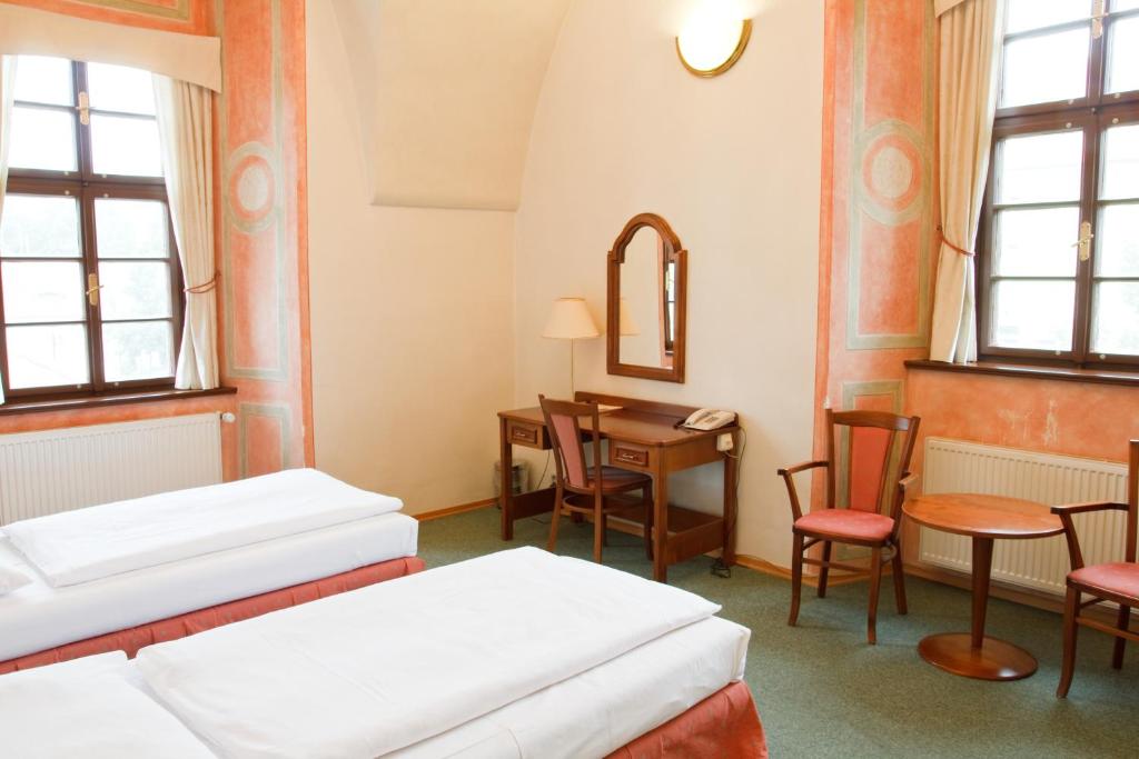 Postel nebo postele na pokoji v ubytování Adalbert Ecohotel