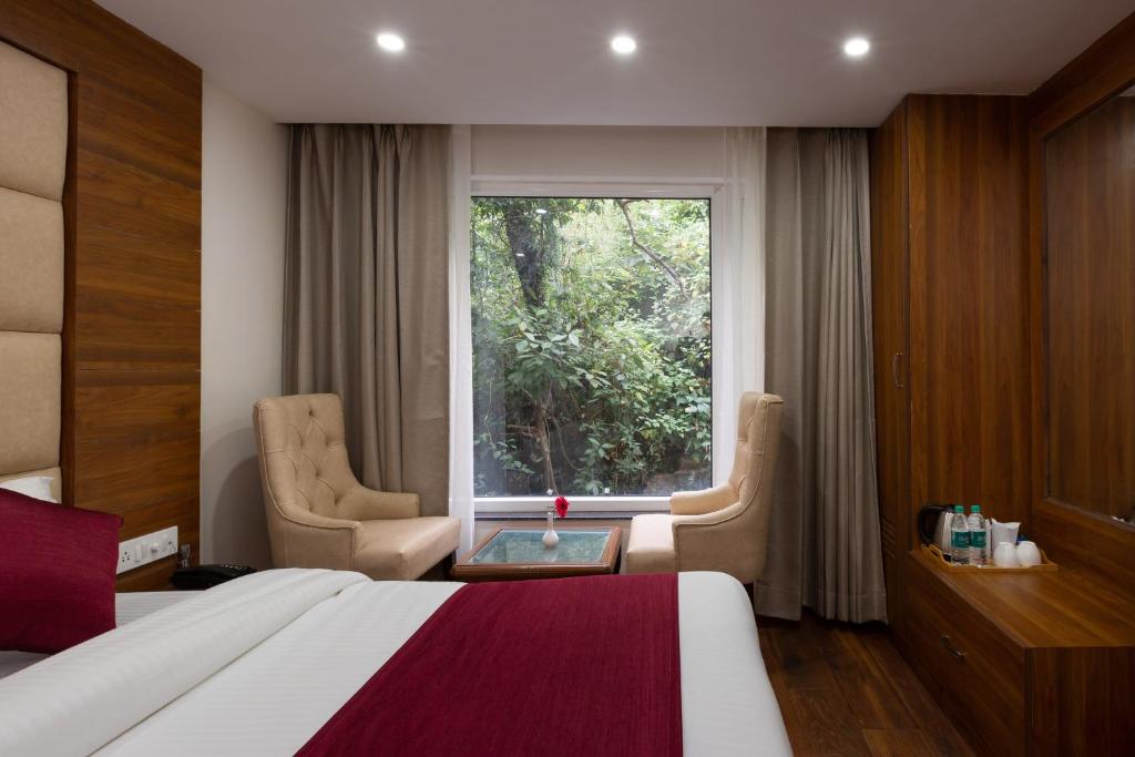 Postel nebo postele na pokoji v ubytování Hotel Wild Wood