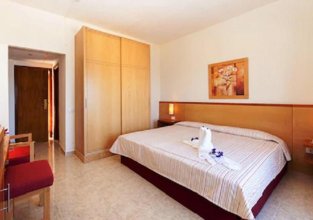 Łóżko lub łóżka w pokoju w obiekcie Hotel Marquesa