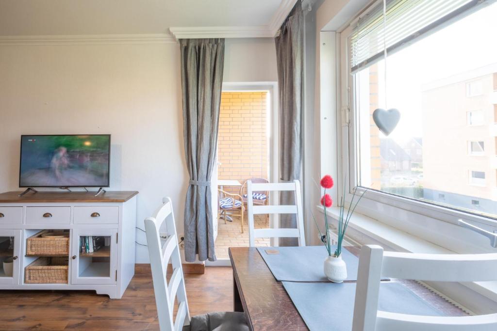 TV a/nebo společenská místnost v ubytování Lütte Bude