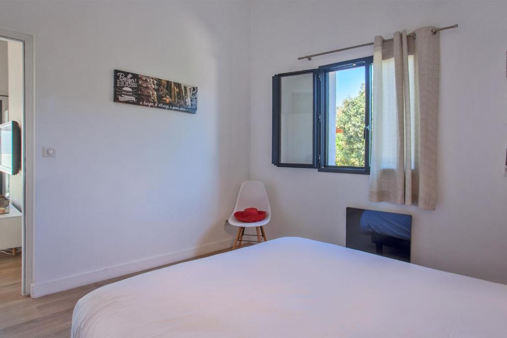 Postel nebo postele na pokoji v ubytování Casa Sol location de vacances indépendante à Calvi moins de 2km plage