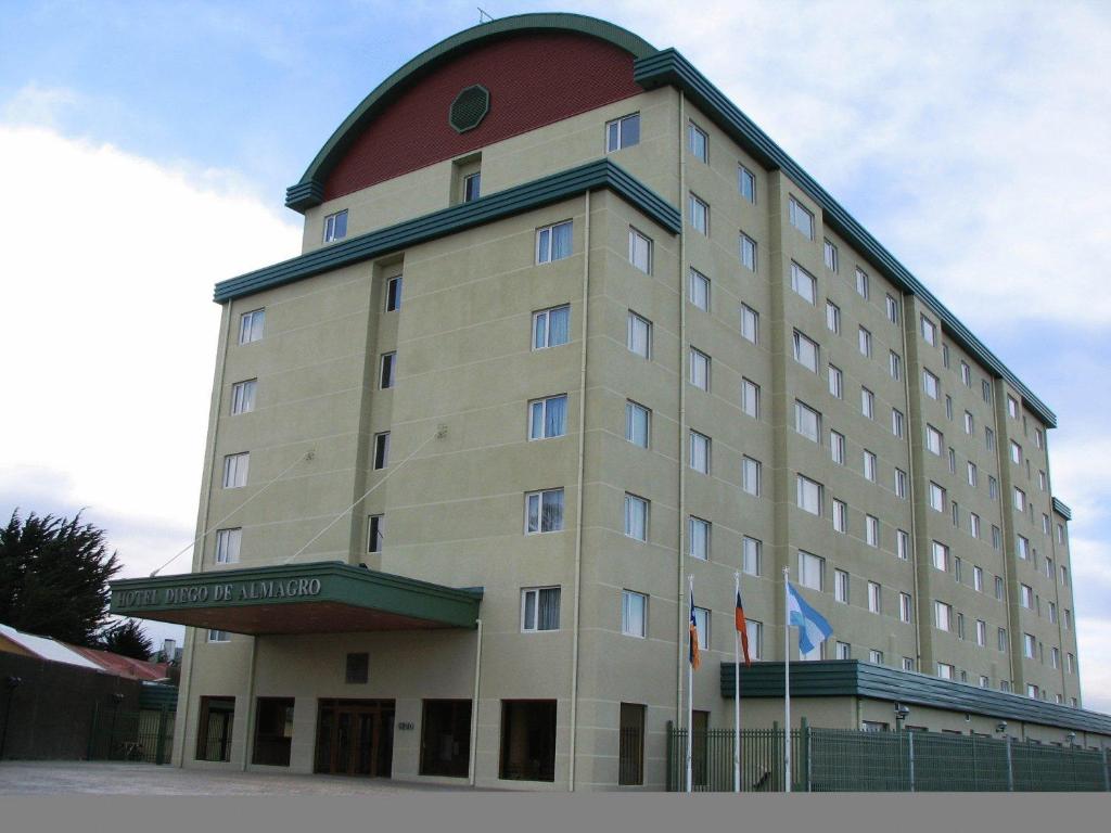 a large building with a large clock on the front of it at Hotel Diego de Almagro Punta Arenas in Punta Arenas