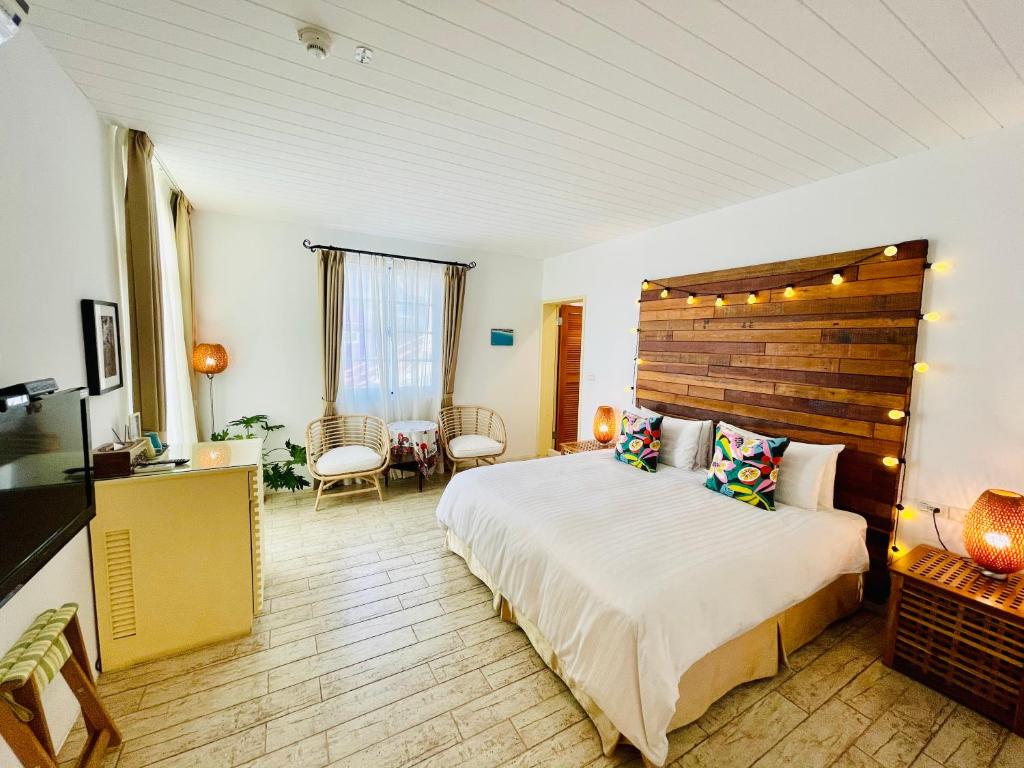 Postel nebo postele na pokoji v ubytování SpoonDrift Hostal Kenting