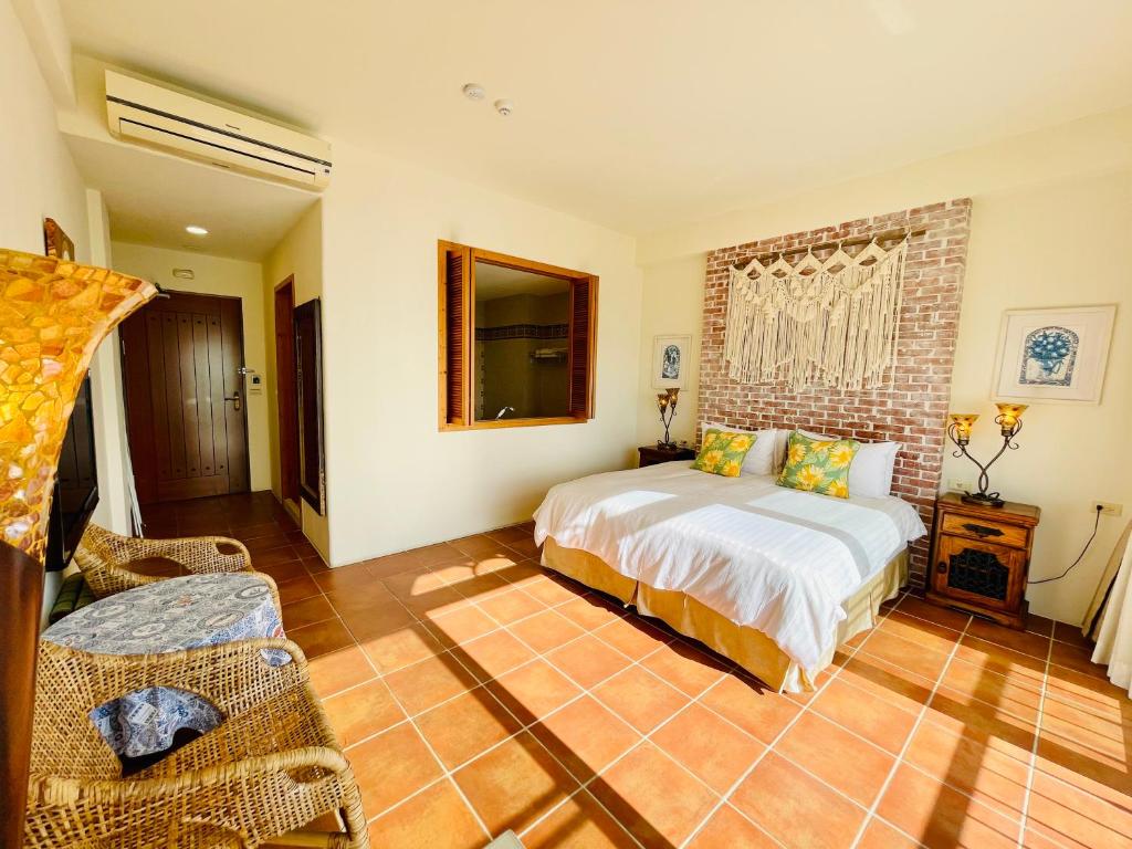 Postel nebo postele na pokoji v ubytování SpoonDrift Hostal Kenting