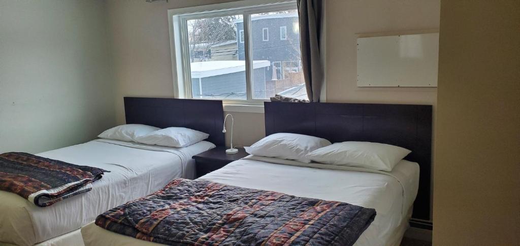 Postel nebo postele na pokoji v ubytování BUDGET LODGE