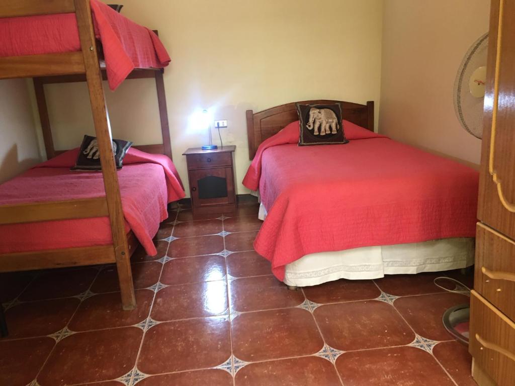 Postel nebo postele na pokoji v ubytování Hostal Puritama