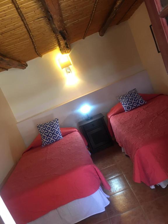 Postel nebo postele na pokoji v ubytování Hostal Puritama