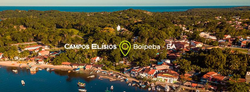 an aerial view of an island with boats in the water at Campos Elísios Boipeba in Ilha de Boipeba