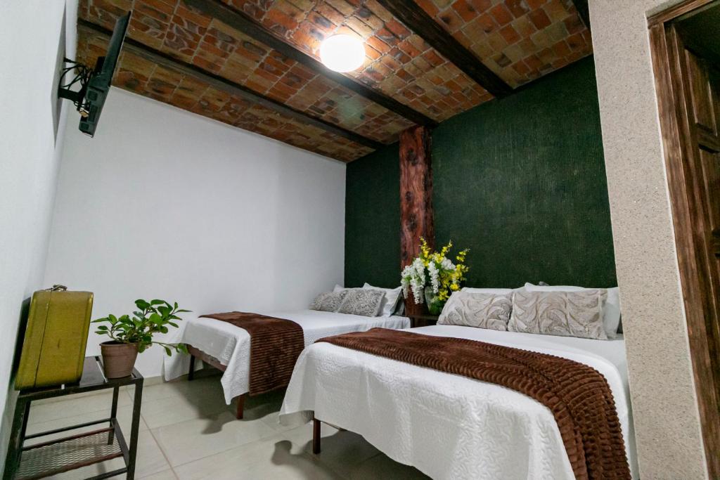 Postel nebo postele na pokoji v ubytování Casa De Rey