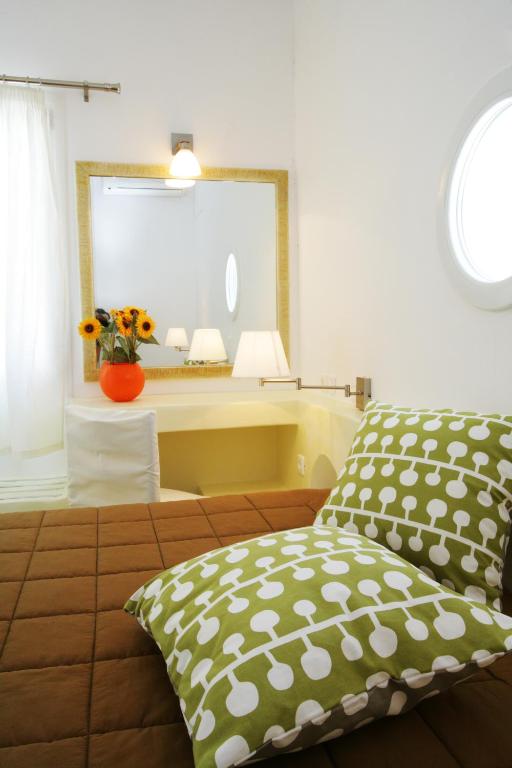 Postel nebo postele na pokoji v ubytování Porto Raphael Residences & Suites