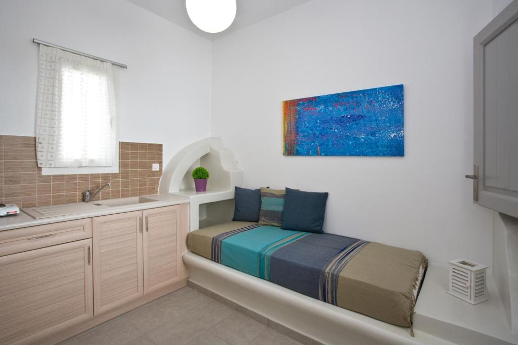 Postel nebo postele na pokoji v ubytování Porto Raphael Residences & Suites