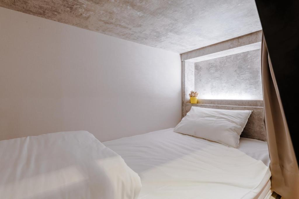 Postel nebo postele na pokoji v ubytování Prince Hotel