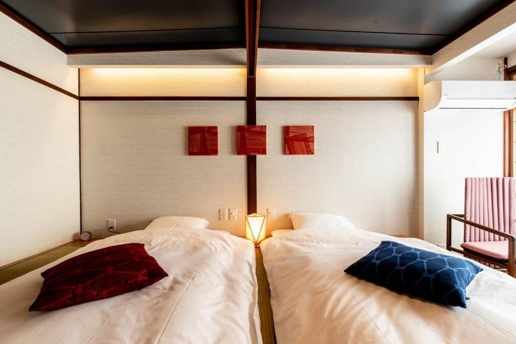 Giường trong phòng chung tại Tabiyado Chirin