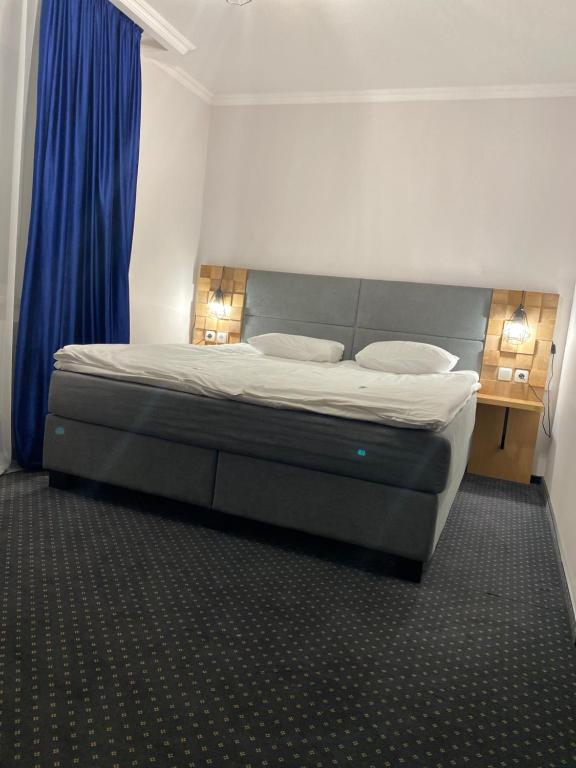 Postel nebo postele na pokoji v ubytování Grofa Apartments