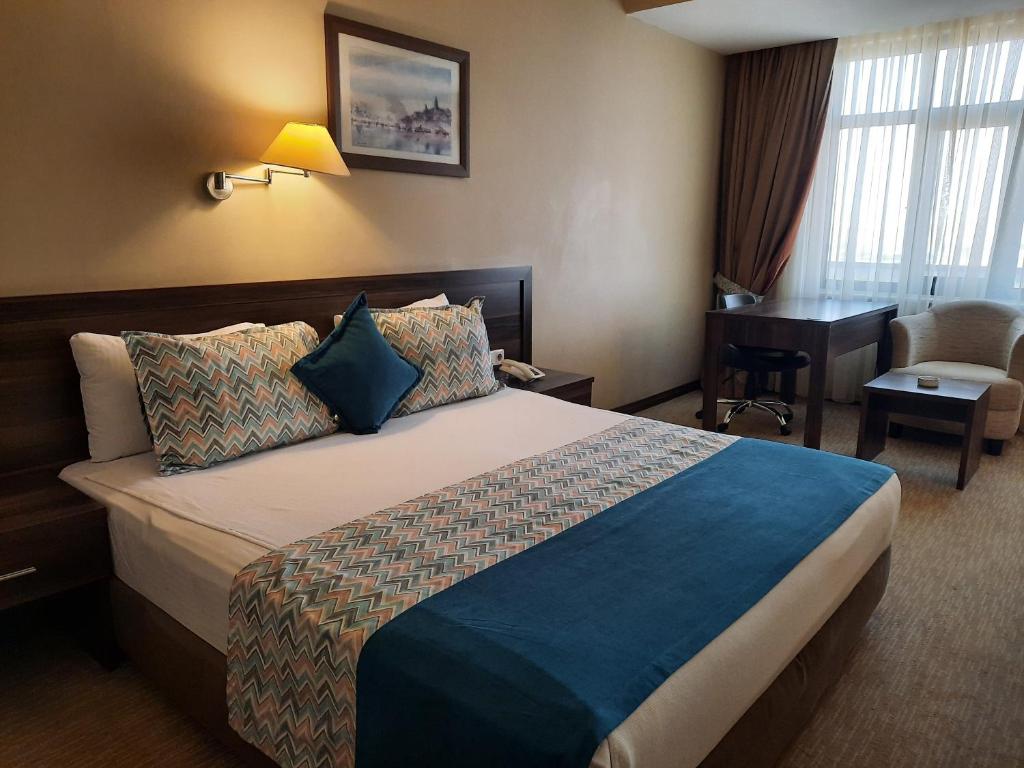 Postel nebo postele na pokoji v ubytování Plaza Hotel Diyarbakir