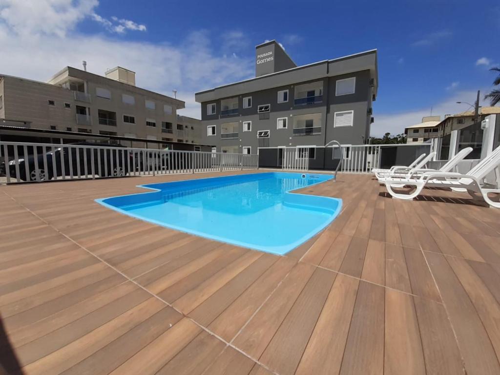 a swimming pool on the roof of a building at Pousada Gomes in Florianópolis